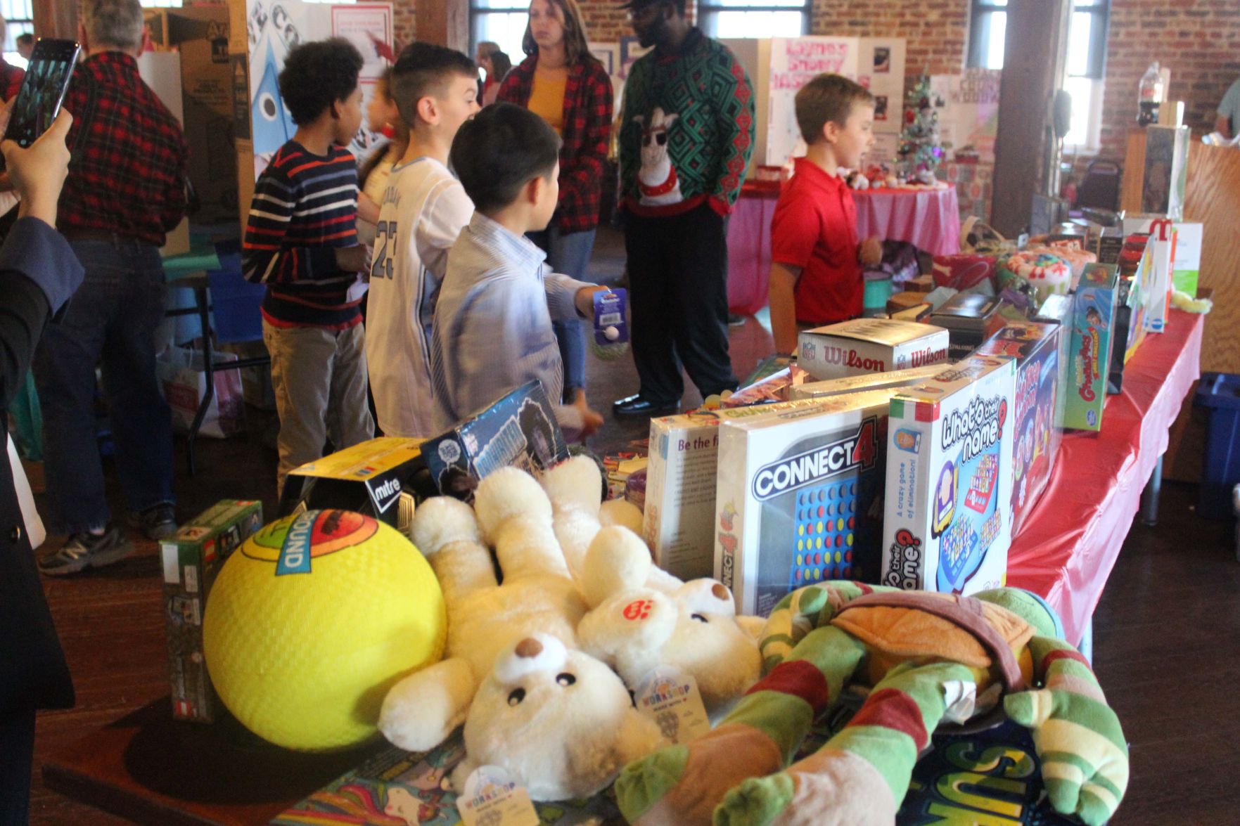 Checking out toys for the auction.jpg